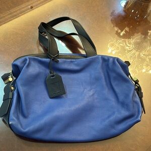Reed Krakoff royal blue barrel bag.